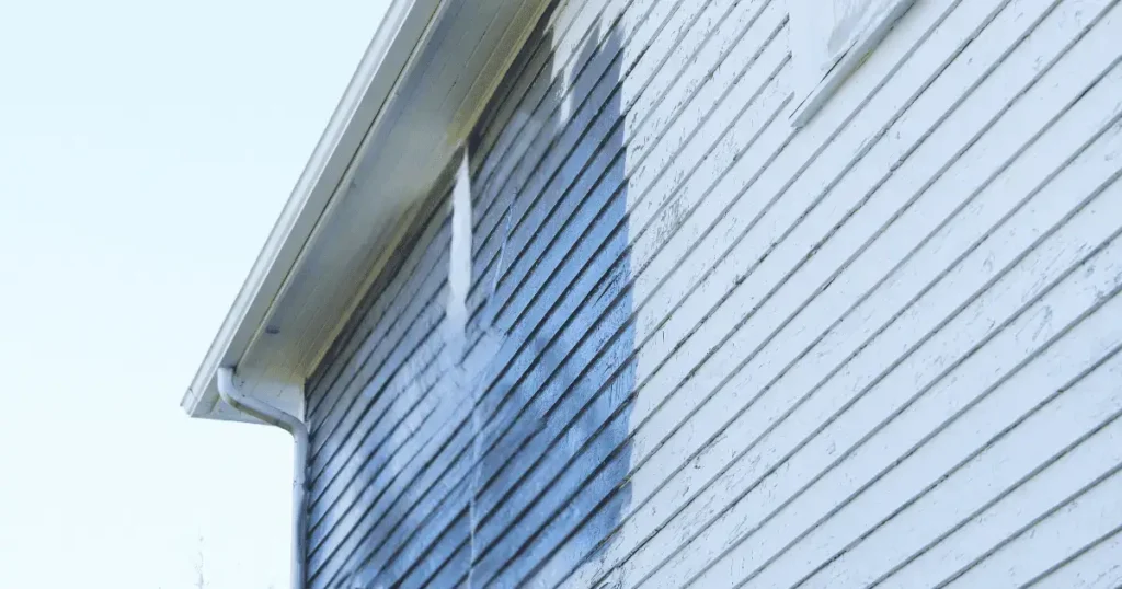 House with blue fading paint