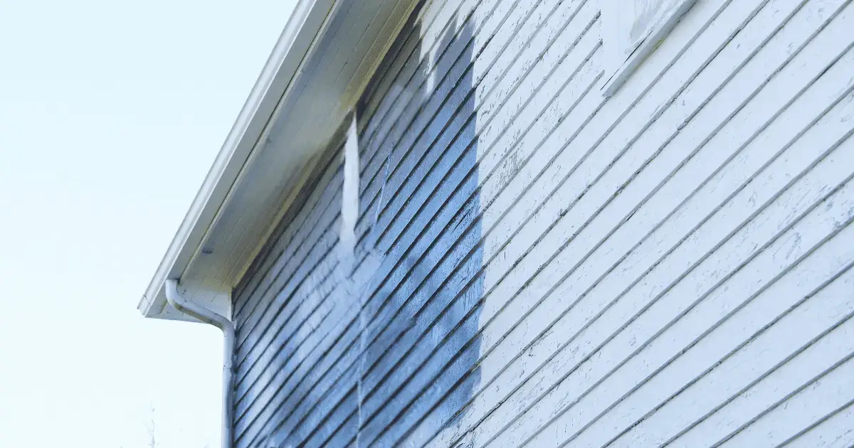 House with blue fading paint